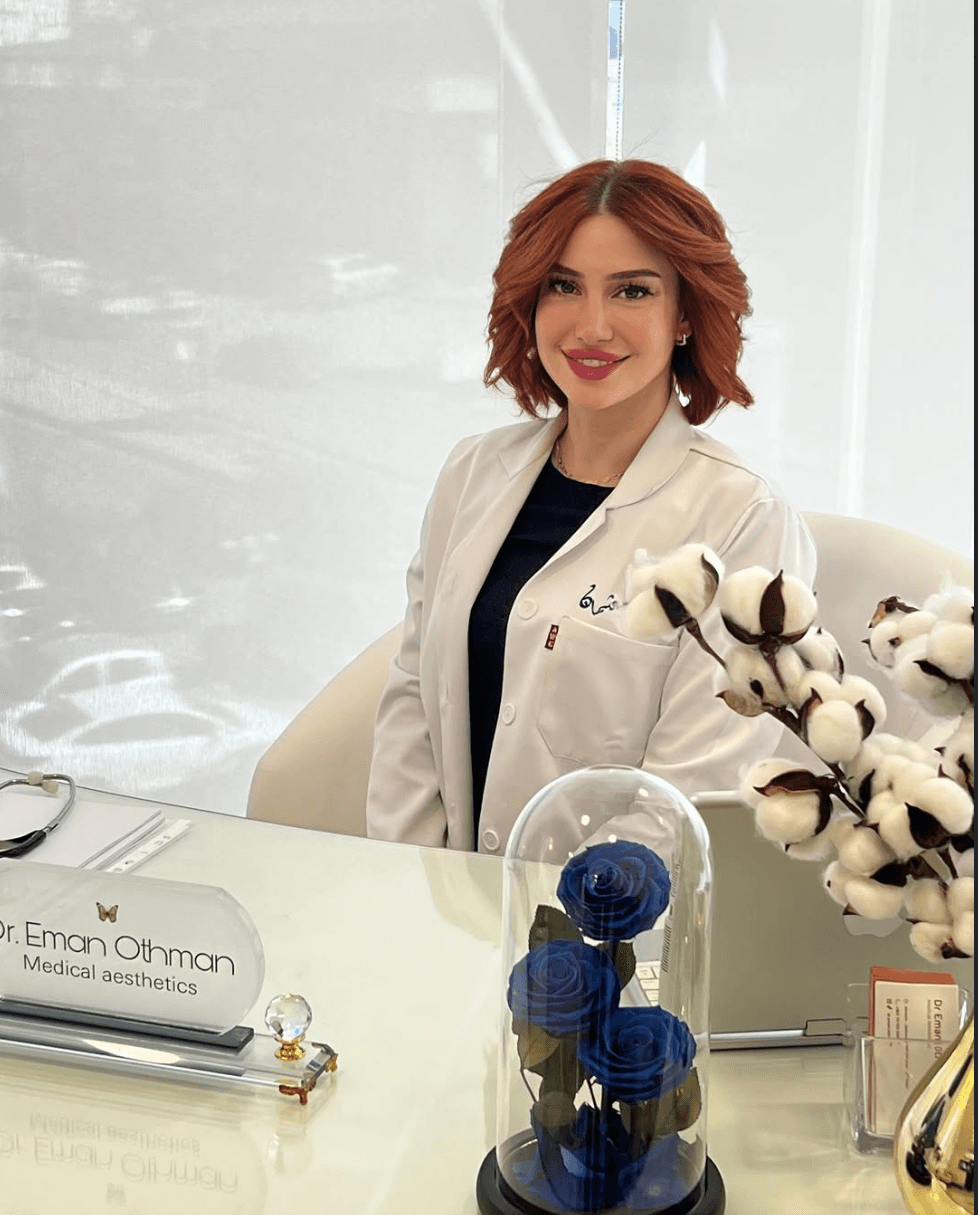 Dr. Eman Othman at her consultation desk, Dr. Eman Othman Medical Aesthetics